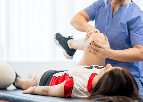 young athlete receiving physical therapy